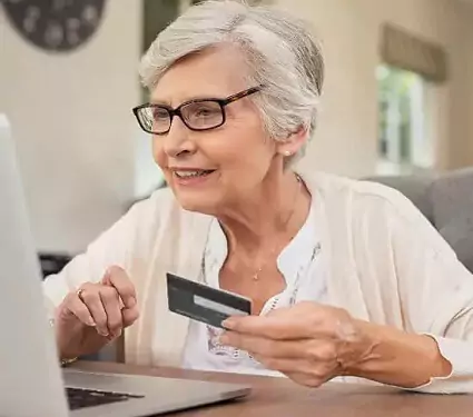 senior lady paying for care